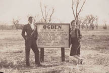 Elmer with Betty Lou by Ogden town sign.