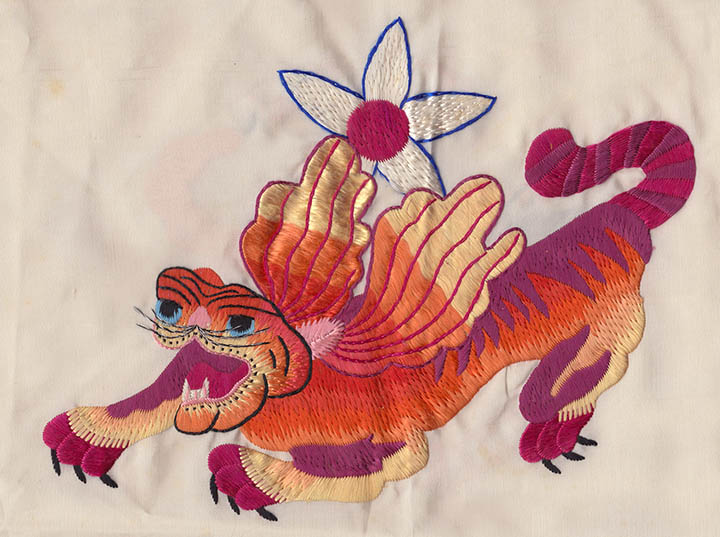 Silk scarf embroidered with the insignia of the Fourteenth Air Force, presented by fellow pilots to Norman's parents after his death. Courtesy of the Niemeier family.